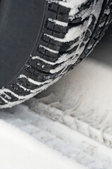 close of of car tire on snow