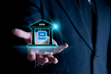 Fintech. Businessman holding financial technology on screen. Online banking, Business investment banking payment technology concept