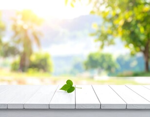 View of a wooden table with a clover leaf and a blurred natural background