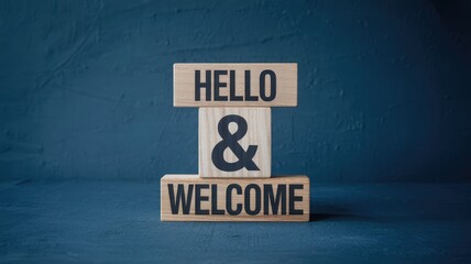 Obraz premium Hello and Welcome message on stacked wooden blocks on a dark blue textured background with soft ligh