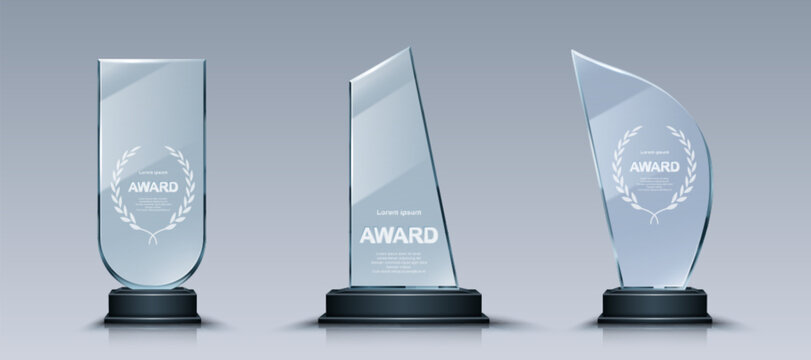 Glass trophy set with elegant laurel wreath engravings on crystal plates. Transparent award collection with unique glass shapes on dark pedestals designs for business or sport recognition ceremonies. - Powered by Adobe