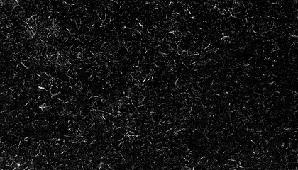 Image shows textured black surface with scattered white specks, resembling noise or static. pattern is random and abstract, creating chaotic