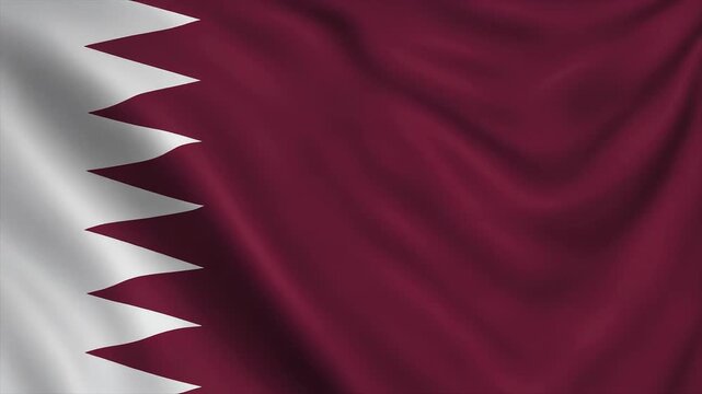 Close-up of the Qatari flag waving with a white and maroon color scheme and a serrated edge pattern on a white background.