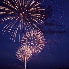 Stunning golden fireworks exploding in the deep blue night sky during a celebration or festival