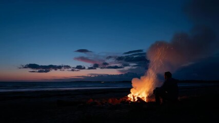 Serene evening at the beach with volcanic activity and colorful sky