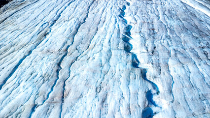 Melting glacial ice reveals stunning blue crevasses in athabasca glacier