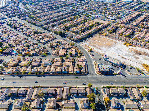 Aerial perspective of Los Angeles suburban housing development with arterial road and surrounding communities