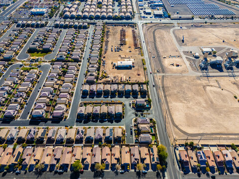 Aerial view of suburban housing grid in Los Angeles, showing dense residential blocks, straight streets, and planned urban development