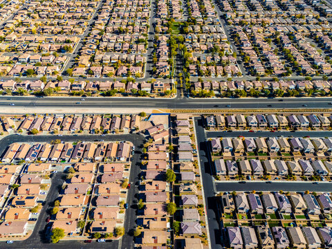 Aerial view of suburban housing grid in Los Angeles, showing dense residential blocks, straight streets, and planned urban development