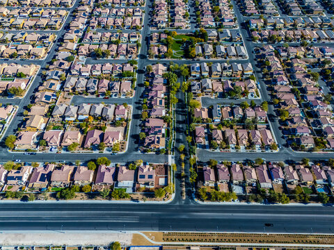 Aerial view of suburban housing grid in Los Angeles, showing dense residential blocks, straight streets, and planned urban development