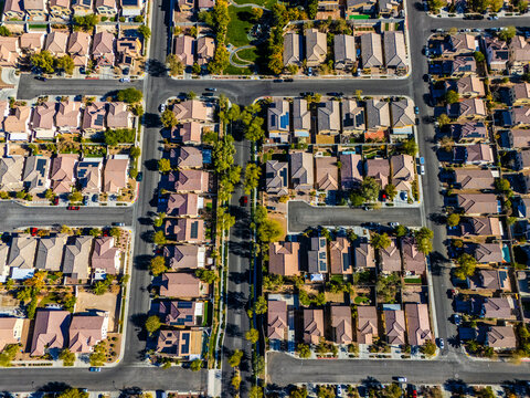 Aerial view of suburban housing grid in Los Angeles, showing dense residential blocks, straight streets, and planned urban development