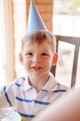 Happy child enjoys birthday celebration at home