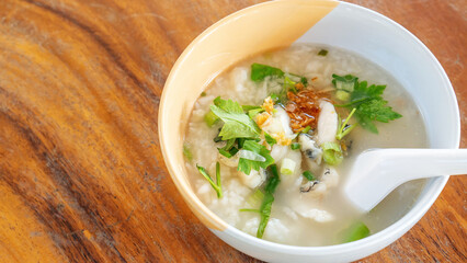 Fish porridge on a wooden table.