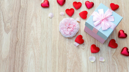 Pink gift box and a pink rose flower for a Valentine's Day festival.