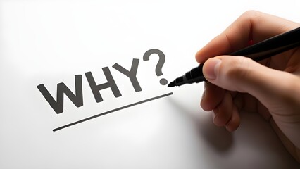 Close up of a human hand writing the word why followed by a question mark with a black marker on white paper
