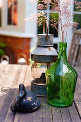 Decorative objects on wooden table at outdoor setting