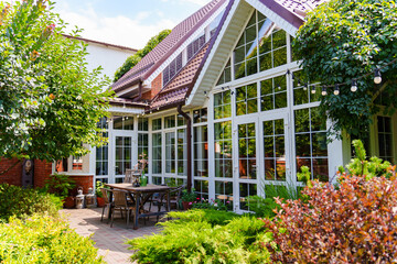 Cozy outdoor space with plants and wooden table setup