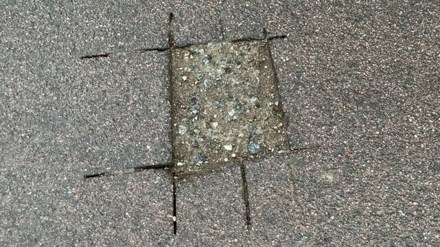 Place of selection of the kernel in the form of a rectangular from asphalt concrete pavement. Kern. Close-up
