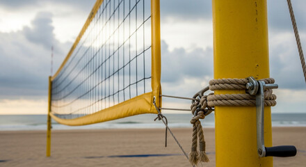Beach Volleyball Net in Yellow Pole with Rope and Cloudy Sky in Soft Focus for Sports