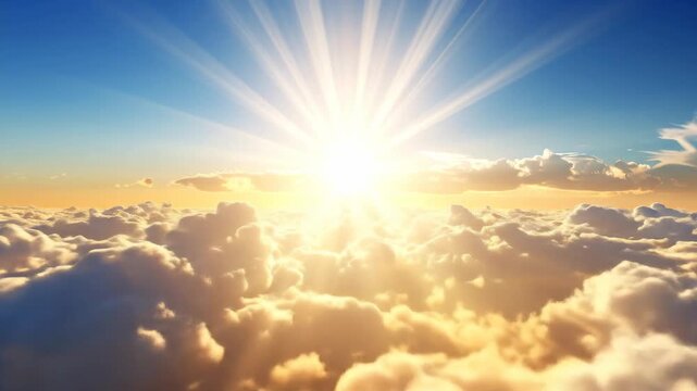 Bright sunbeams shining through fluffy clouds in a clear blue sky.