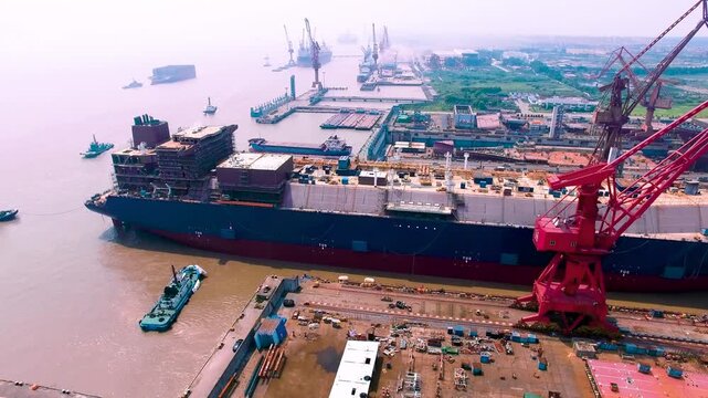 Shipbuilding Facility with Cargo Ship and Industrial Manufacturing Equipment