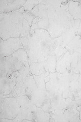 White concrete surface with cracks. Cement wall texture with a rough effect. Backdrop for construction and architecture projects.