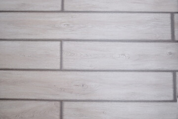 Flat lay of distressed light gray wood planks wallpaper texture. Rustic wooden surface for background or creative design element in interior.