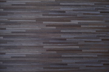 Horizontal view of dark wood floor texture. Natural timber surface background for home interior or product display. Rustic hardwood pattern.