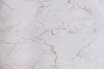 White and brown marble texture with natural veins. Elegant stone surface for architectural design, interior material, or background.