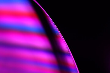 Purple liquid surface, phenomenal structure, green oils on a dark background, colourful abstract, surrealistic art, iridescent effect