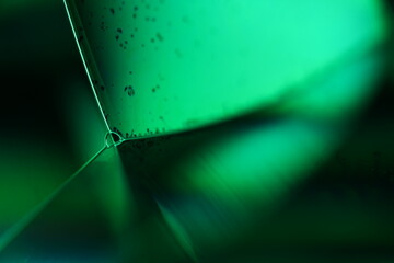 Green liquid surface, phenomenal structure, green oils on a dark background, colourful luminous abstract, surrealistic art, glowing effects