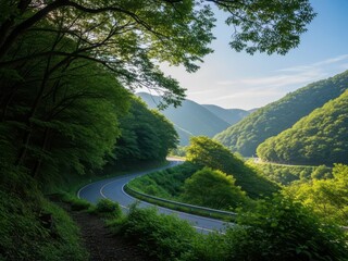 A serene mountain landscape with a winding road surrounded by lush green trees