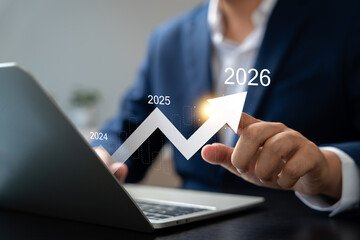 New Year 2026, Businessman using laptop to create new business plan for 2026. Strategy include setting goal,Development organizational direction,Objective,Target new opportunities for future growth.