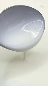 Cold refreshing white buttermilk texture close-up. Food background, vertical video