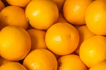 Orange fruit background fresh food. Ripe juicy oranges, top view, close up.