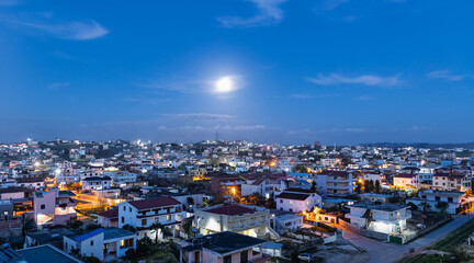Areal panoramic view of Durres Albania. Full Moon Over Illuminated town At Night with Urban Sky Glow