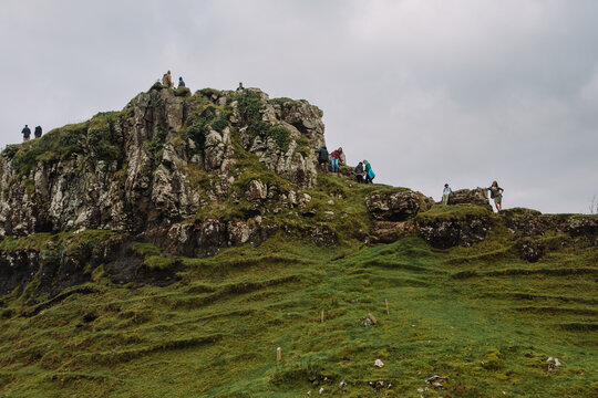 A magical and ethereal landscape photograph of the Fairy Glen (Bail nan Cnoc) near Uig on the Isle of Skye. The image features the iconic basalt outcrop known as Castle Ewen, which resembles a ruined 