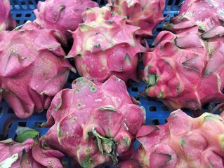 Fresh Dragon Fruit Displayed at Traditional Market Stall