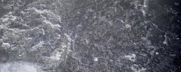 Ice breaking is the sign of weather changing from freezing cold to warmer. Ice surface on the river with daylight in winter.