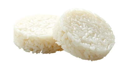 Two perfectly formed, oval-shaped mounds of cooked, fluffy, white rice, close-up