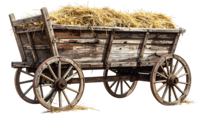 An old, wooden wagon filled with hay, showcasing aged wood and large spoked wheels