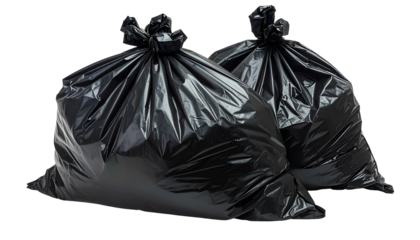 Two tied-up opaque black plastic garbage bags sit against a plain background