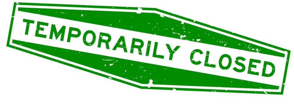 Grunge green temporily closed word hexagon rubber seal stamp on white background