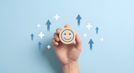 hand holding smiley face with arrows and plus signs