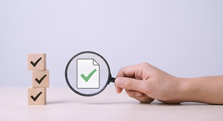 magnifying glass checking document with green checkmark
