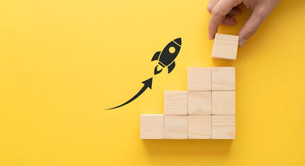 Business growth concept with wooden blocks and rocket