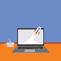 laptop with rocket on the screen