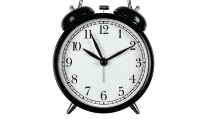 A classic black and white alarm clock showing the time