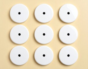 Nine white circles, black dot centers, arranged in a grid