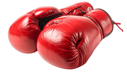 Pair of bright red leather boxing gloves sit atop a black background